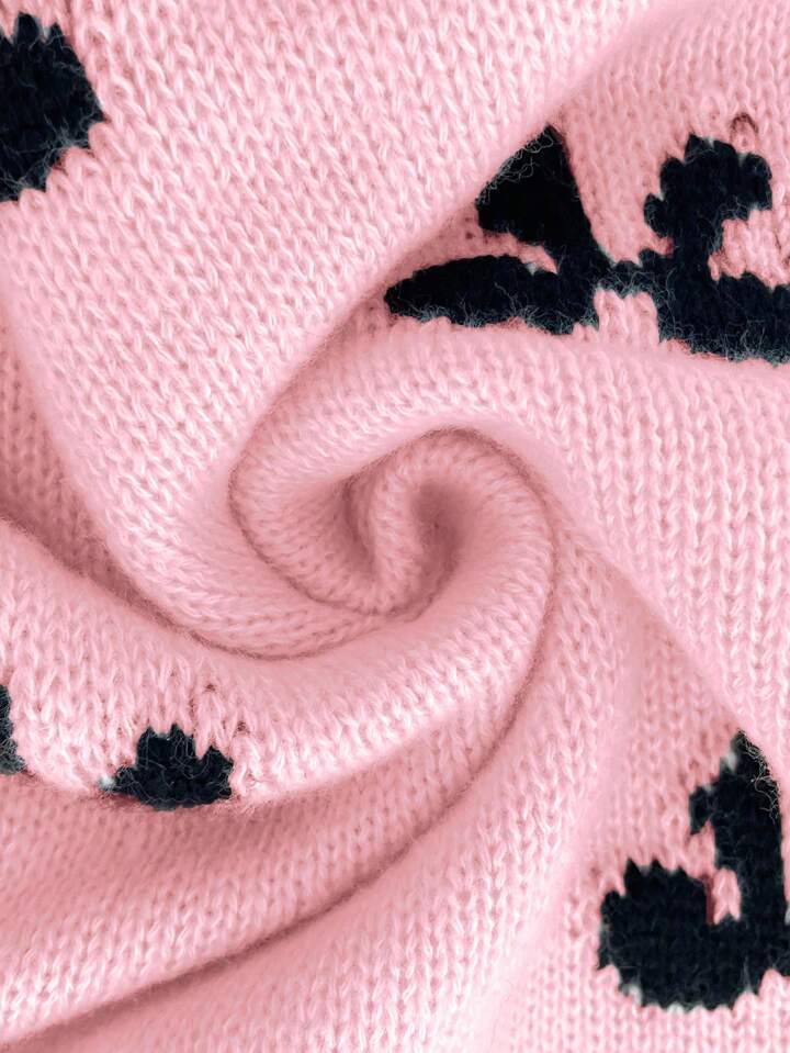 Pink Knit Sweater with Black Bow Pattern – Cozy Oversized Pullover