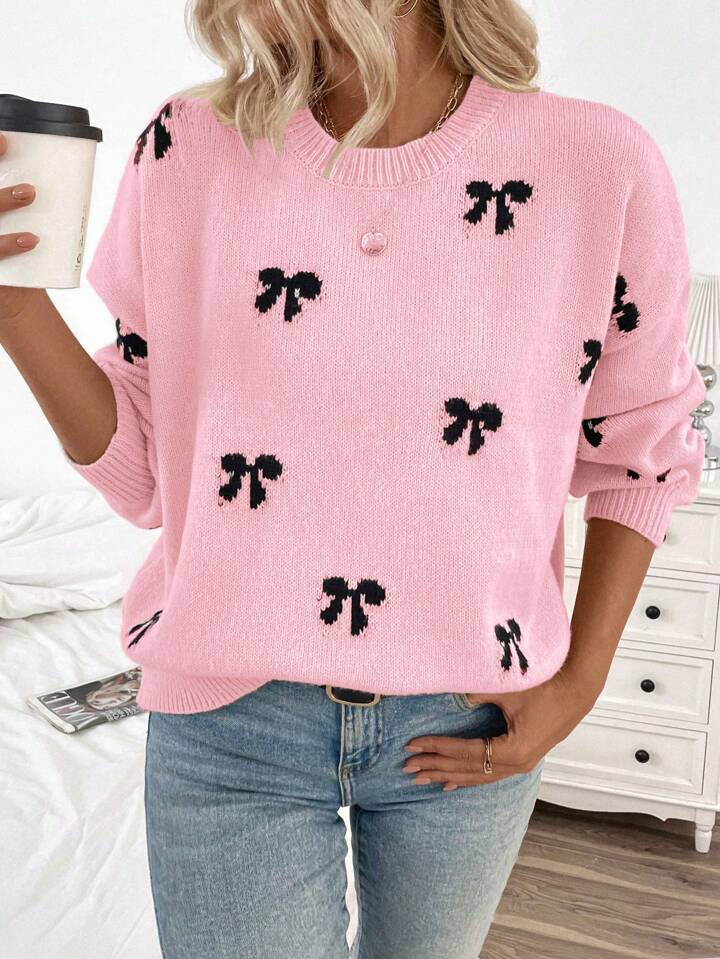 Pink Knit Sweater with Black Bow Pattern – Cozy Oversized Pullover