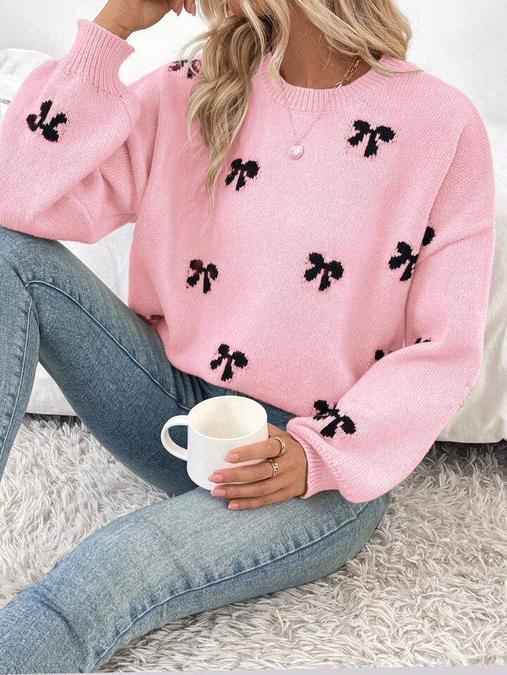 Pink Knit Sweater with Black Bow Pattern – Cozy Oversized Pullover